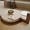 Modern Round Coffee Table With Marble Top Wooden Legs Green Fruits Bowl Books Sofa Blanket