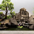 Traditional Courtyard Garden Featuring Rockery Pine Tree Bamboo Small Pond And Lush Greenery