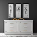 Elegant White Console Side Cabinet with Golden Handles and Three Framed Paintings Above