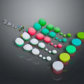 Colorful Wooden And Stone Round Objects With Various Sizes Arranged On Reflective Base