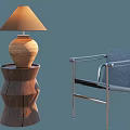 Modern Leisure Chair with Metal Frame and Gray Cushion Alongside Wooden Side Table and Lamp