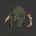 Intricate Metallic Helmet Carving Sculpture With Curved Designs And Horn Like Structures