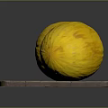 Two fresh yellow melons placed on a natural wooden cutting board