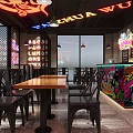 Modern Restaurant Interior With Neon Signage Graffiti Wall Brick Decor And Black Tables