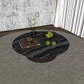Round Black Marble Coffee Table Featuring Clear Vase Green Plant Glass Bowl Green Apples Book