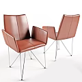Two Modern Brown Leather Office Chairs With Sleek Metal Legs And Comfortable Design