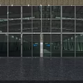 Modern Glass Entrance Gate With Metal Frame Stone Wall And Dark Floor