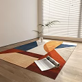 Square Area Rug With Geometric Patterns On Wooden Floor By Potted Plant And Open Magazine