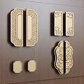 Decorative Carved Door Handles on Wooden Background with Intricate Patterns and Symmetric Shapes