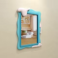 Blue Frame Mirror With Melted Cream Effect Reflecting Bed Pillows And Quilt On Beige Wall