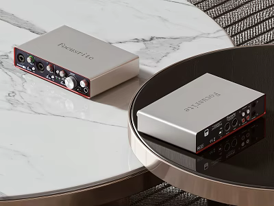Two Professional Focusrite Entertainment Electronics Audio Interfaces On White Marble Tabletop 3d model