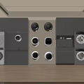 Modern Laundry Room With Washing Machines Dryers Circular Appliances And Gray Cabinetry