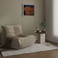 Beige Bean Bag Chair With Brown Blanket Side Table And Plant Decor On Light Rug