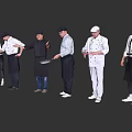 Group of Chefs in Different Uniforms Posing with Cooking Tools and Utensils