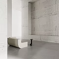 Modern Minimalist Living Room With White Walls Gray Flooring White Sofa And Black Table