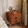Wooden Bedside Table With Drawers Black Knobs Metal Legs And Vase With Flowers