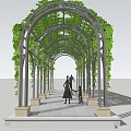 Arch Pergola Covered With Green Vines And People Walking On Stone Path