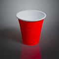 Red Disposable Plastic Cup with White Inner Rim on Dark Background with Reflection 3d model
