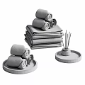 Cozy Home Living Essentials With Rolled Towels Stacked Blankets And Aromatherapy Reed Diffuser On Trays