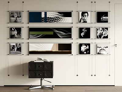 Abstract Paintings Gallery Wall with Black Cabinet Wheels and Open Book 3d model