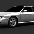 Silver Two Door Coupe With Sleek Body Lines And Sporty Wheels Design