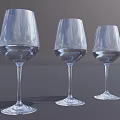 Three Transparent Stemmed Wine Glasses Filled With Water On Dark Surface Grey Background