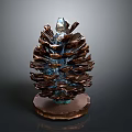 Artistic Metallic Pinecone Sculpture With Brown Base And Blue Glossy Details