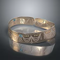 Elegant Gold Bracelet With Intricate Filigree Design And Blue Gemstone Accents