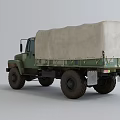 Military Green Truck with Canvas Covered Cargo Bed and Off-Road Exterior Design