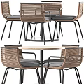 Round Wooden Table And Four Woven Chairs Set With Black Metal Frames And Gray Cushions