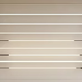 Minimalist Modern Linear Light Fixtures With Various Designs Neatly Arranged On Light Colored Background Wall