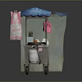 Mobile Food Cart with Blue Canopy Featuring Cooking Utensils Condiment Bottles Hanging Cloths and Wheels