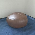 Round Brown Leather Stool Placed On Blue Carpet In Room Corner 3d model