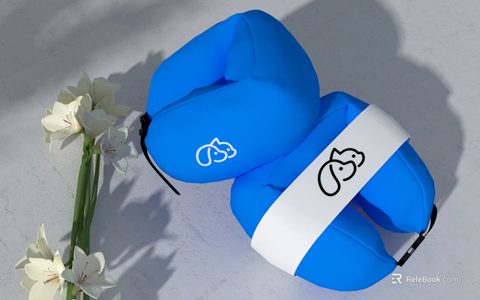 Blue U Shaped Neck Pillow With White Strap And Cartoon Design Near White Flowers 3d model 