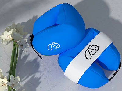 Blue U Shaped Neck Pillow With White Strap And Cartoon Design Near White Flowers 3d model