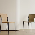 Modern Dining Chairs With Black Metal Frames And Beige Fabric Seats In Minimalist Interior
