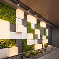 Illuminated Feature Wall With Green Moss White And Gray Square Panels And Decorative Stones
