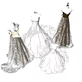 Elegant White and Gold Wedding Dresses with Lace Details on Mannequin