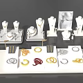 Elegant Jewelry Display With Gold Silver Red Rings Bracelets On White Trays