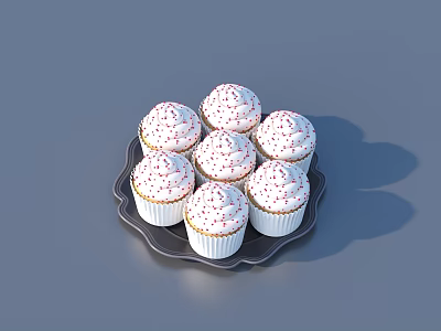 Seven Cupcakes With White Frosting And Red Sprinkles On Black Plate 3d model