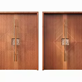 Classic Wooden Double Doors With Intricate Carved Texture And Metal Accents