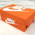 Stylish Orange Nike Shoe Box With White Swoosh Logo And Bottom Hole For Storing Shoes