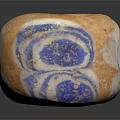 Hand Carved Circular Sculpture With Orange Blue Spiral Patterns And Hollow Center Design