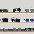Different Styles of Eyeglasses Sunglasses and VR Headset on Display Shelves