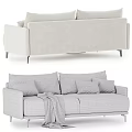 Stylish Beige Two Seater Sofa With Gray Brown Beige Pillows And Gray Blanket