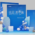 Brand Welcome Event Setup With Blue White Balloons Striped Decorations Flower Arrangements And Brand Logo