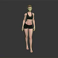 Woman in Black Sports Bra and Black Shorts Standing Barefoot on Dark Background