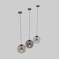 Modern Spherical Pendant Lights With Transparent Semi Transparent Glass Shades And Illuminated Light Bulbs