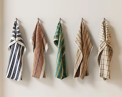 Five Stylish Patterned Towels With Different Designs Hanging On Wall 3d model