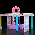 Vibrant Donut Themed Exhibition Booth With Circular Structure And Colorful Decor